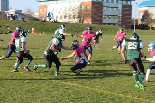 Ollie Tribe Palms Off a Defender.