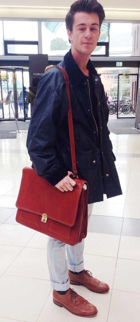 Rhys works his oversized satchel and matches this up with his dark tan boots!