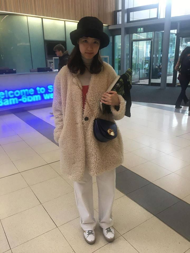 Image may contain: Door, Overcoat, Floor, Hat, Person, Human, Apparel, Clothing, Coat