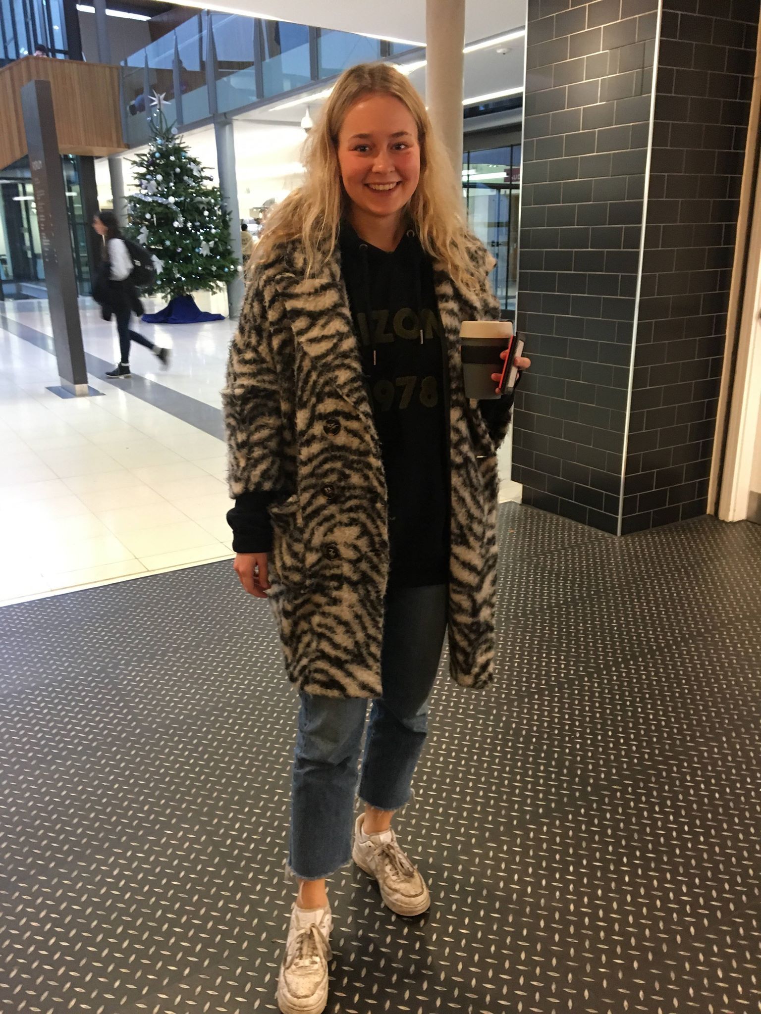 Image may contain: Flooring, Jacket, Long Sleeve, Floor, Sleeve, Coat, Overcoat, Human, Person, Shoe, Footwear, Apparel, Clothing