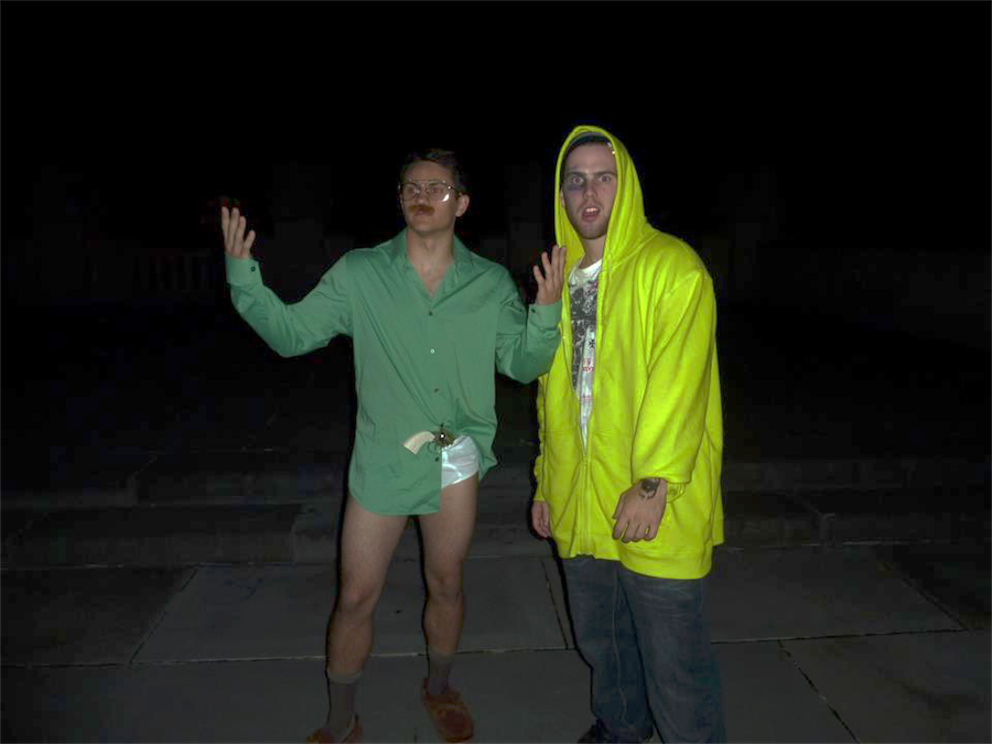 Walter White and Jesse Pinkman pedaling in the Whitman courtyard
