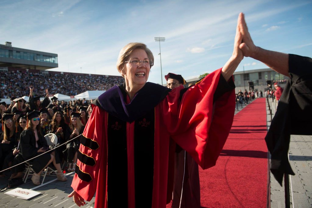 Elizabeth Warren giving a high five at UMass Commencement May 2017