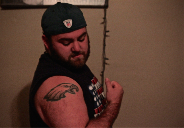 Giampa proudly displays his only tattoo.