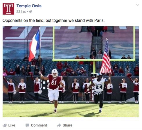 A Temple football player waves the French flag at the game against Memphis on Saturday, Nov. 21.