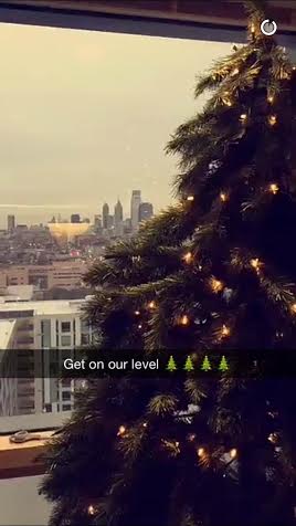 Students post a picture of their holiday decorating to Temple's Snapchat story