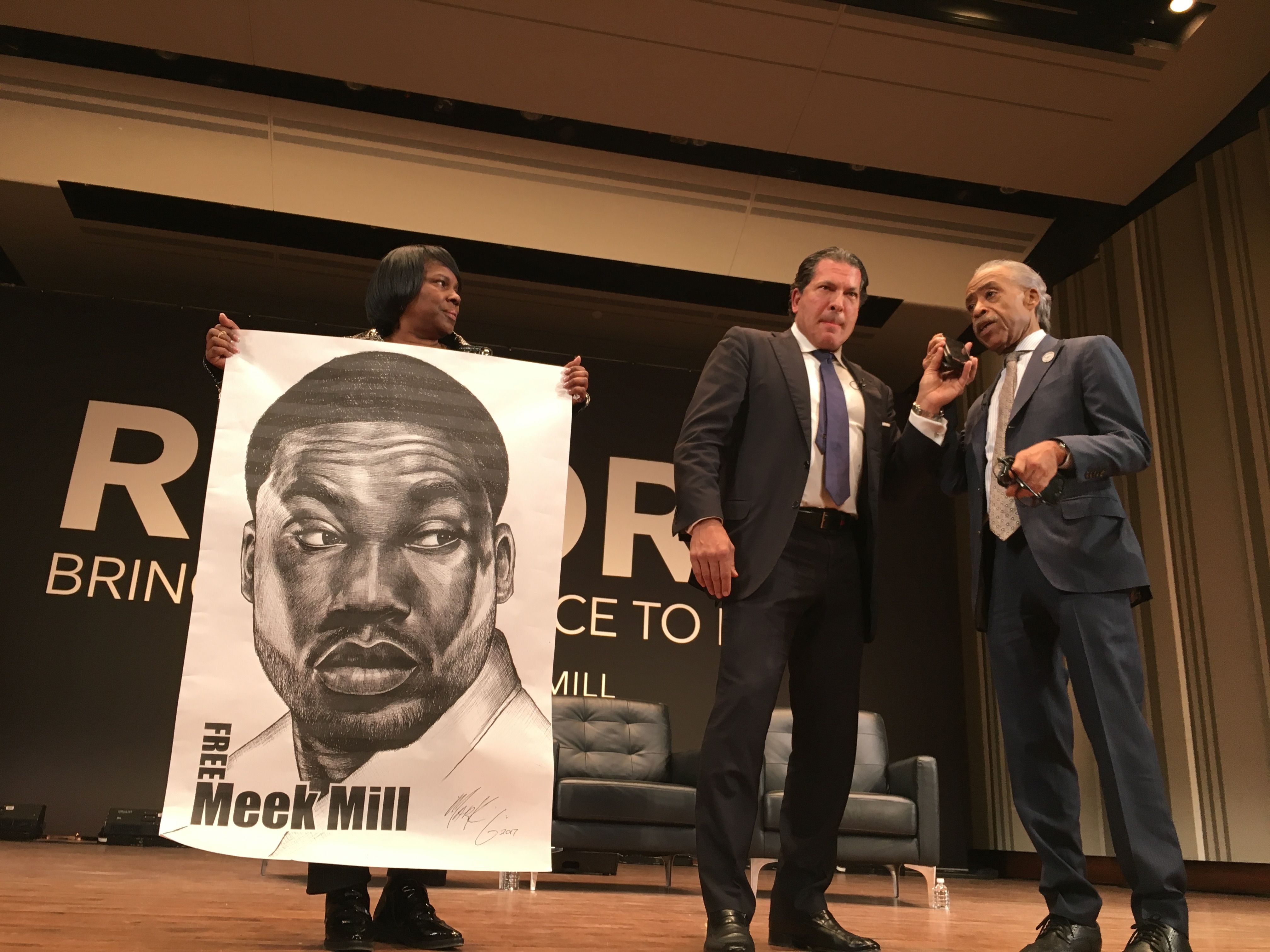 Image may contain: Waiting Room, Room, Reception Room, Reception, Indoors, Furniture, Tuxedo, Suit, Overcoat, Coat, Clothing, Poster, Speech, Crowd, Audience, Person, People, Human