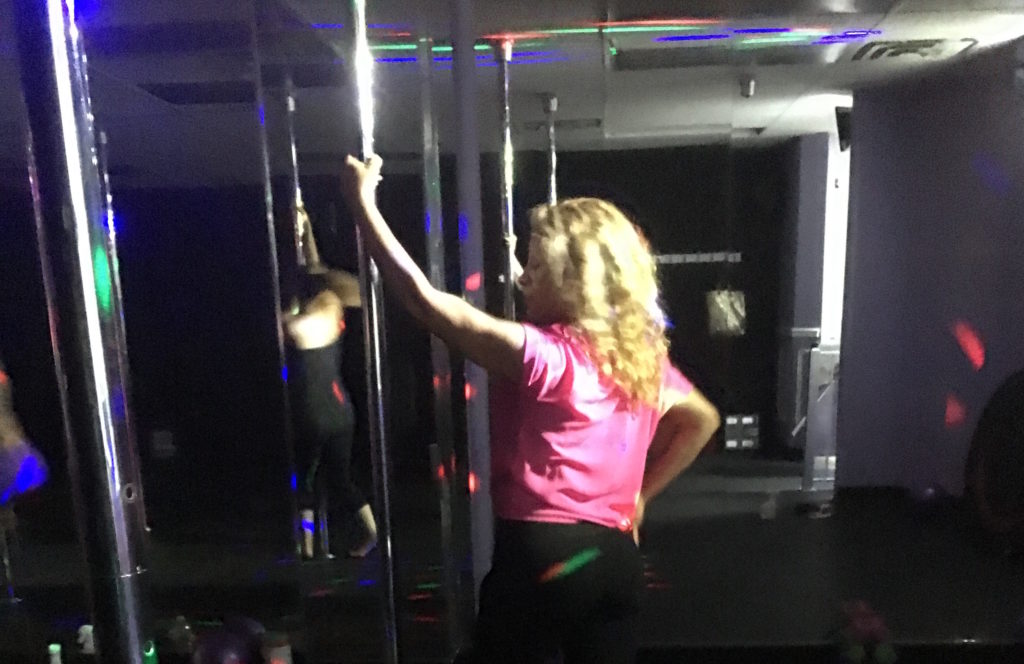 My mother trying out the Pole Fitness class