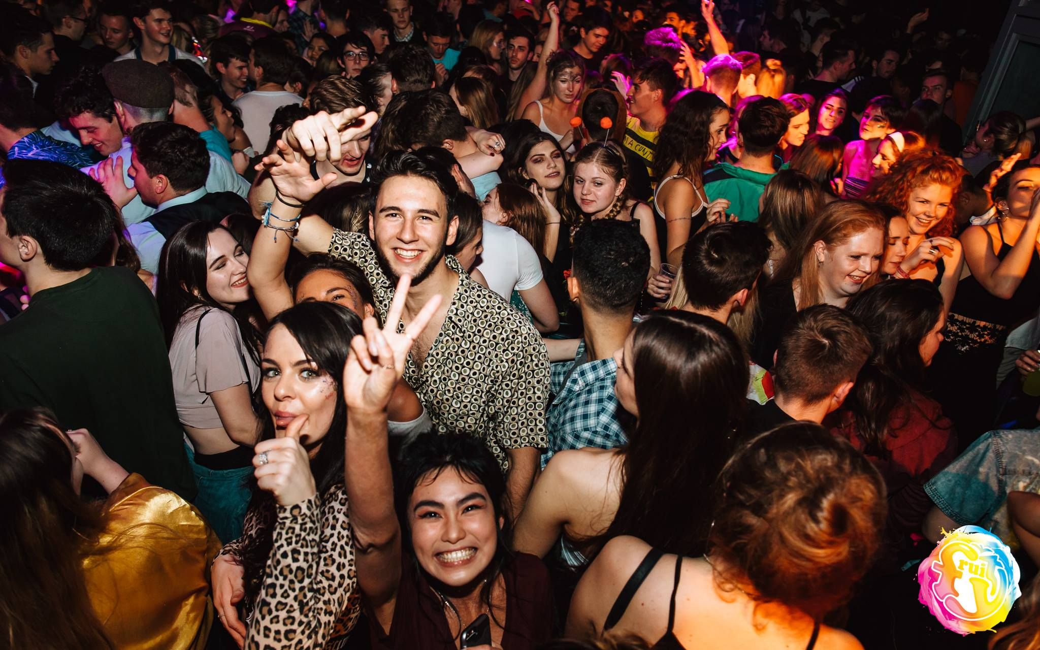 Image may contain: Hair, Afro Hairstyle, Make Out, Party, Smile, Portrait, Face, Crowd, Person, People, Human