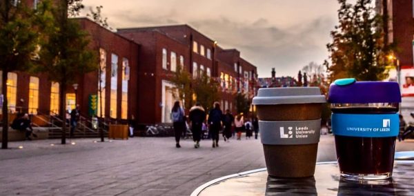 Image may contain: Architecture, Coffee Cup, Cup, Road, Street, Pedestrian, Beverage, Alcohol, Drink, Beer, City, Downtown, Town, Building, Urban, Human, Person