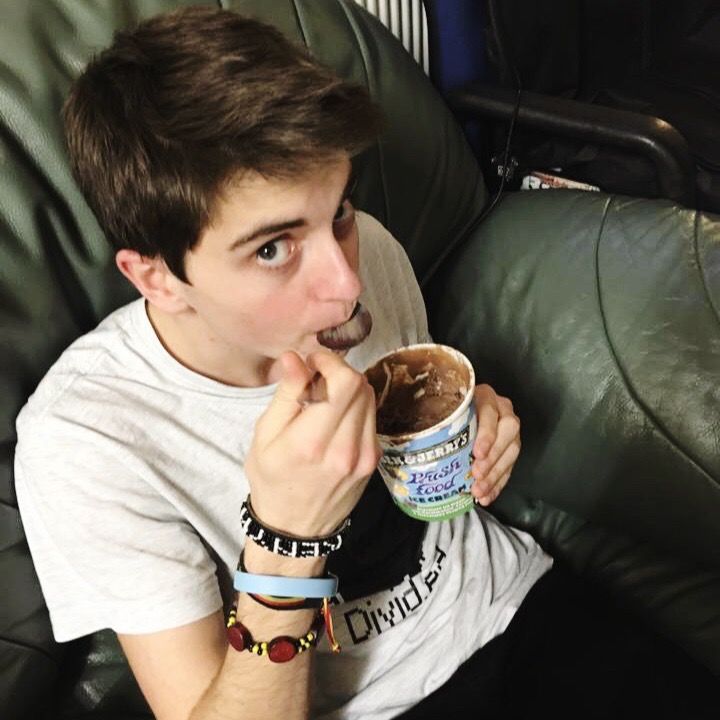 Image may contain: Eating, Face, Sweets, Food, Confectionery, Can, Human, Person, Tin, Furniture, Couch