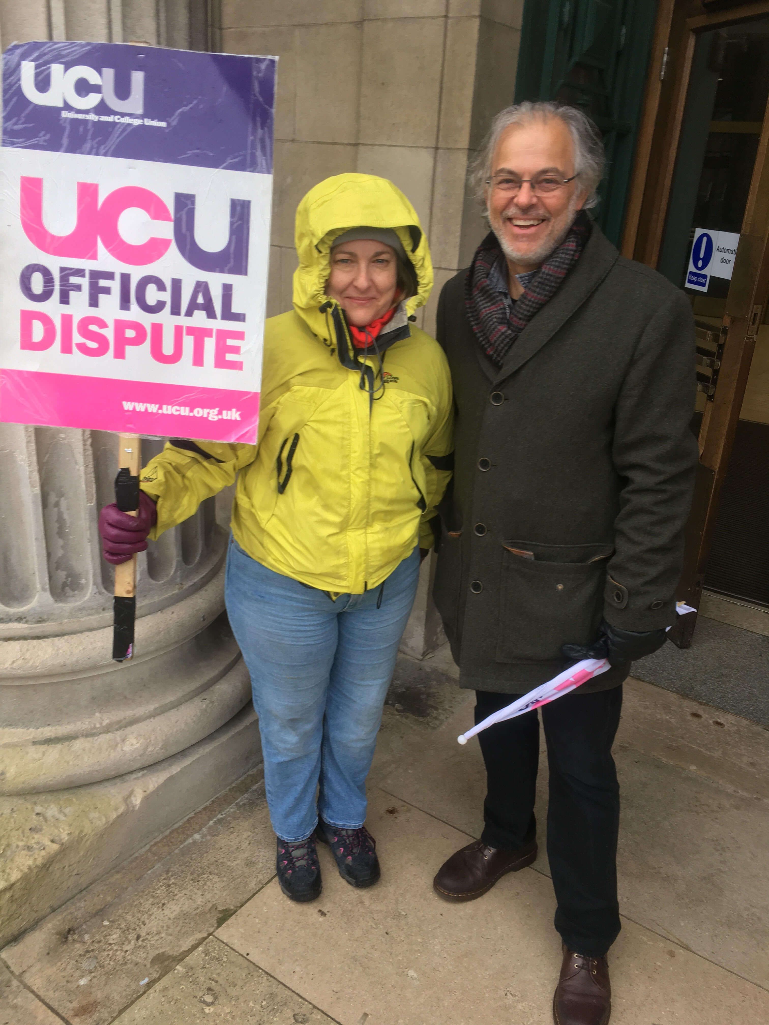 Image may contain: Sleeve, Long Sleeve, Jacket, Text, Overcoat, Jeans, Denim, Coat, Footwear, Shoe, Helmet, Pants, Human, Person, Apparel, Clothing