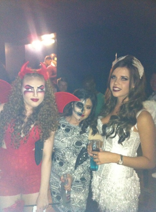 These girls went all out repping the Halloween classic of devils and angels.