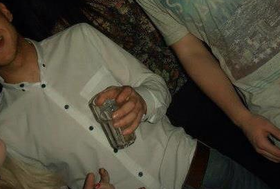 Can you tell who it is in the way he holds his glass?