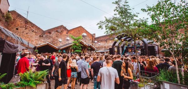 Image may contain: Market, Tree, Bonsai, Barefoot, Crowd, Vase, Pottery, Potted Plant, Plant, Jar, Flora, Person, People, Human