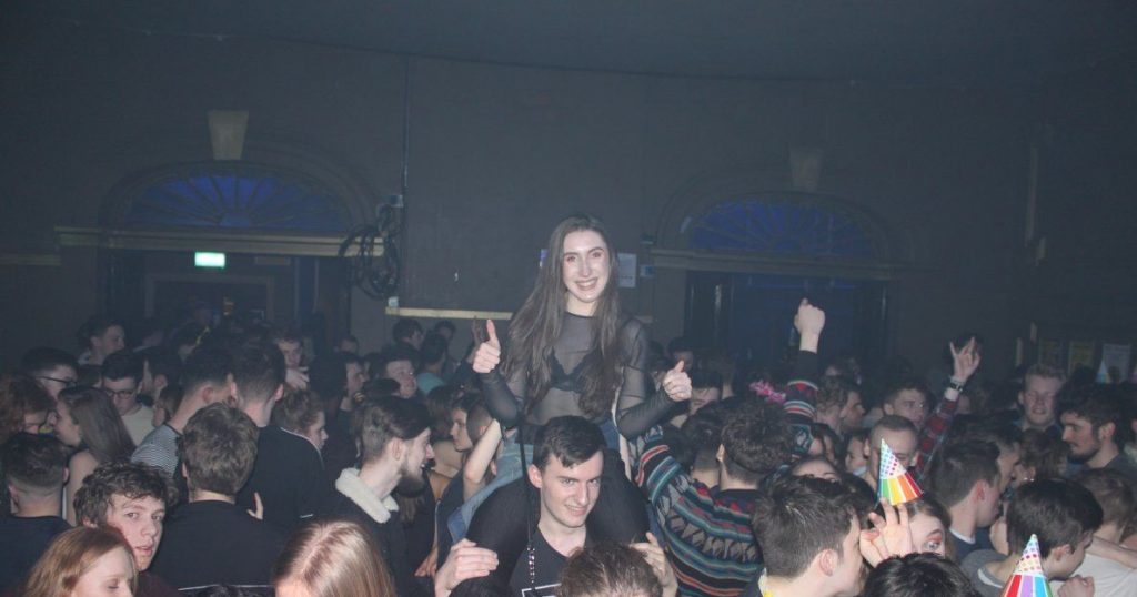 Image may contain: Make Out, Party, Music, Leisure Activities, Crowd, Audience, Person, People, Human