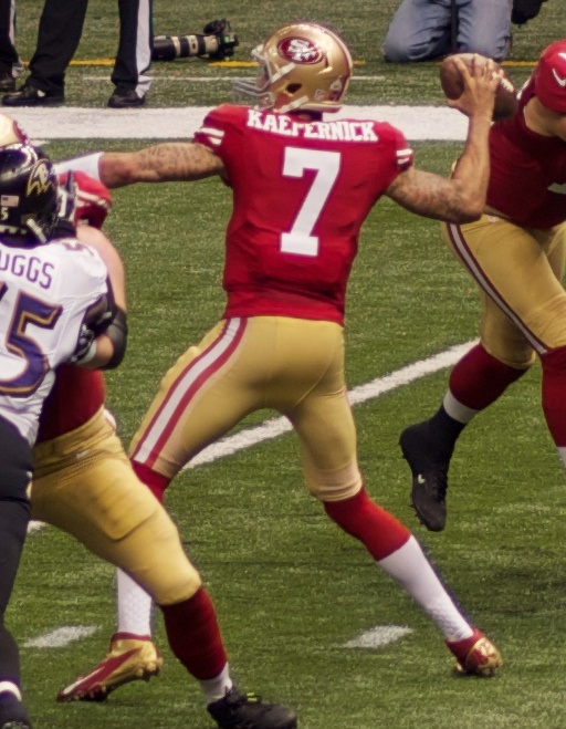 Colin Kaepernick remains seated during the National Anthem