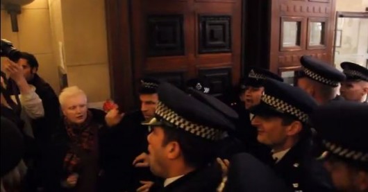 Argy bargy... police pile into Senate House