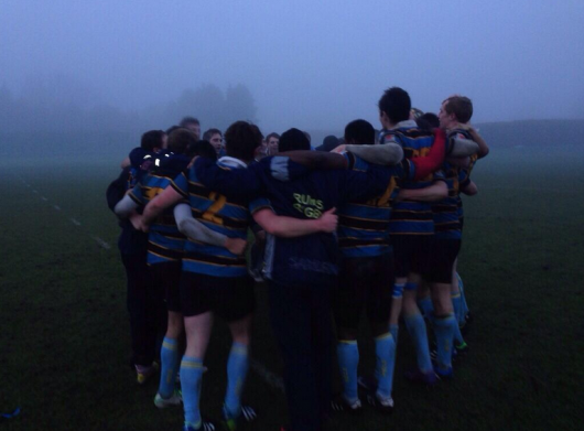 RUMS Rugby men celebrating a win in the lovely British weather.