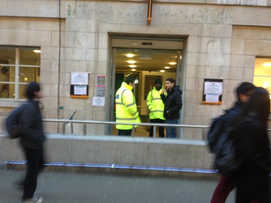 Security shooing people away from the grisly scene