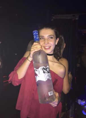 Image may contain: Face, Bottle, Party, Skin, Night Club, Alcohol, Club, Beverage, Drink, Person, Human