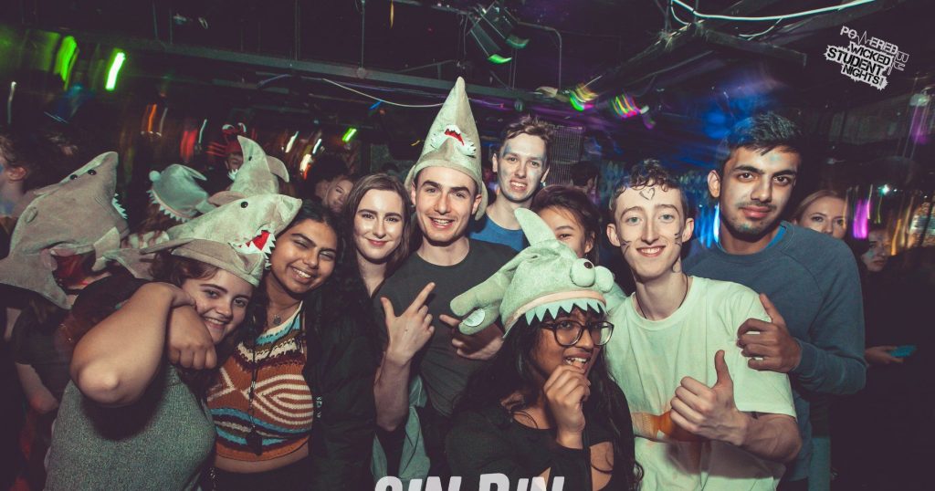 Image may contain: Apparel, Hat, Clothing, Night Club, Club, Party, Human, Person