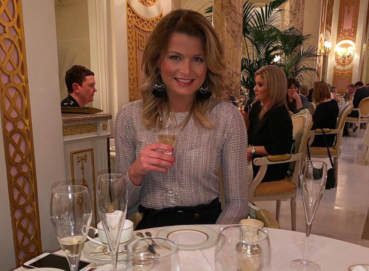 Image may contain: Wine Glass, Wine, Indoors, Room, Beverage, Alcohol, Drink, Goblet, Tablecloth, Home Decor, Food, Food Court, Restaurant, Chair, Glass, Table, Dining Table, Furniture, Person, Human