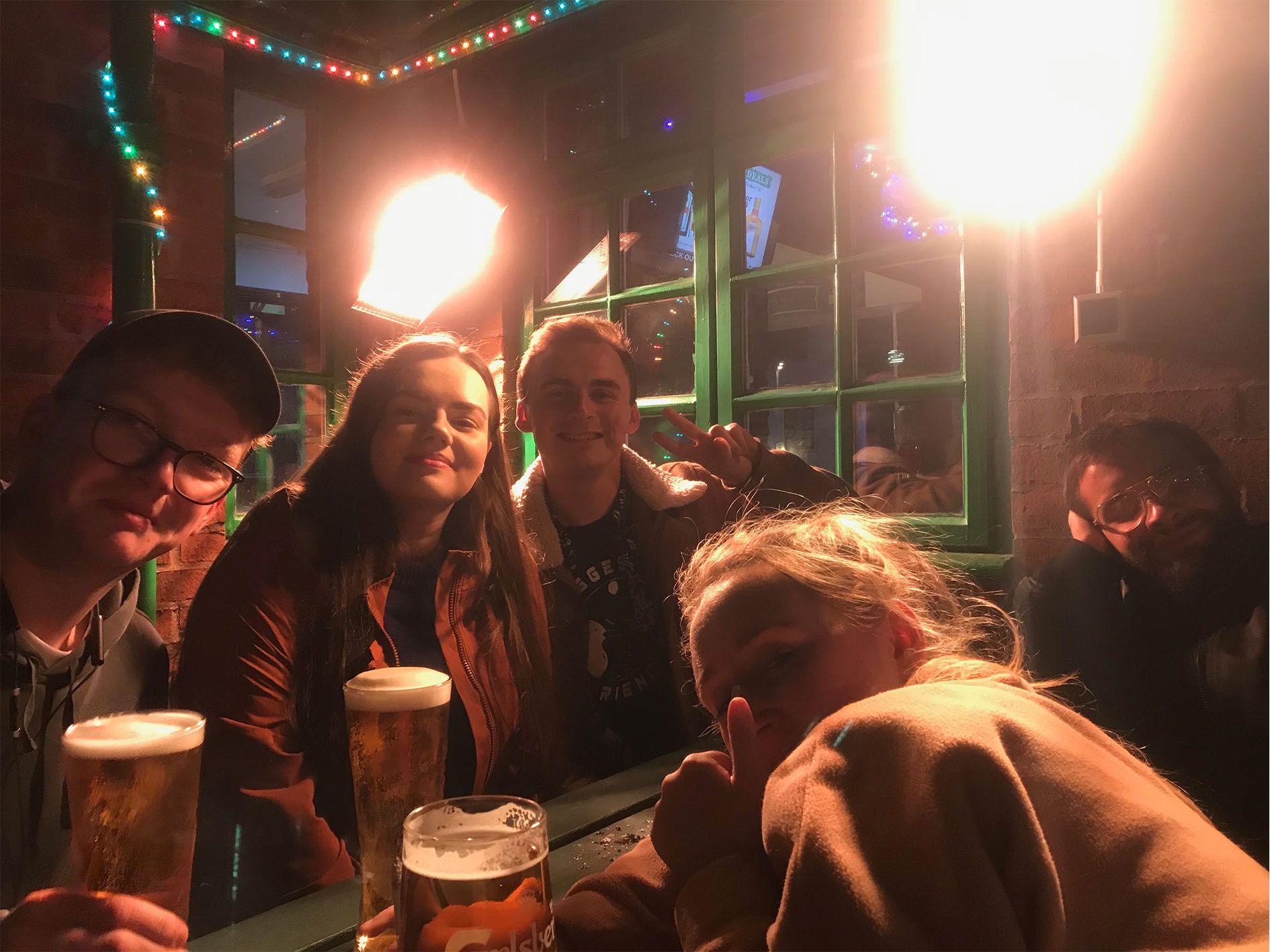 Image may contain: Glass, Glasses, Accessories, Accessory, Light, Flare, Alcohol, Beer, Drink, Beverage, Night Life, Bar Counter, Pub, Person, Human