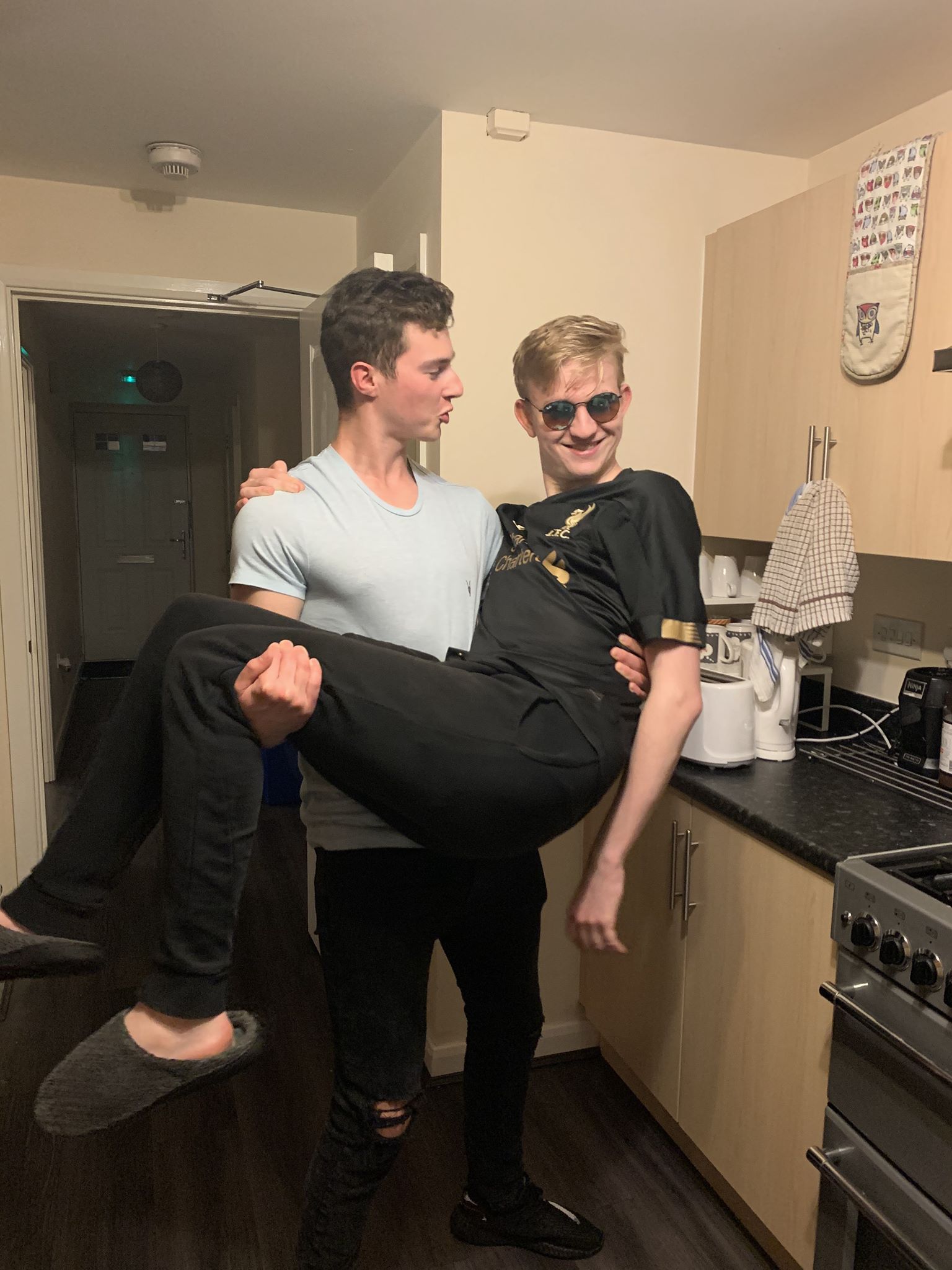 Image may contain: Indoors, Clothing, Apparel, Person, Human, Sunglasses, Accessories, Accessory