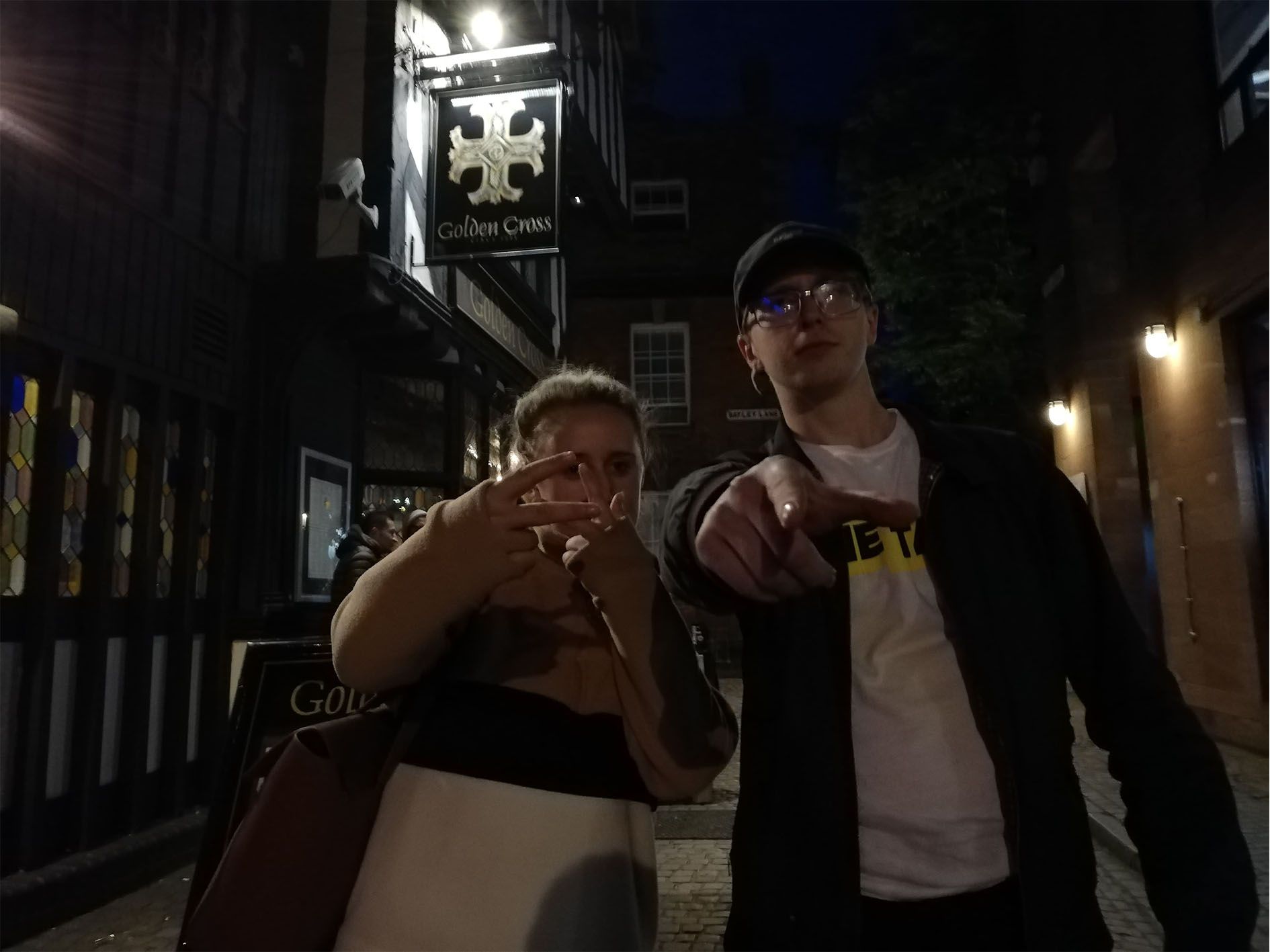 Image may contain: Jacket, Finger, Coat, Pedestrian, Lighting, Outdoors, Accessories, Sunglasses, Accessory, Nature, Night Life, Clothing, Apparel, Human, Person