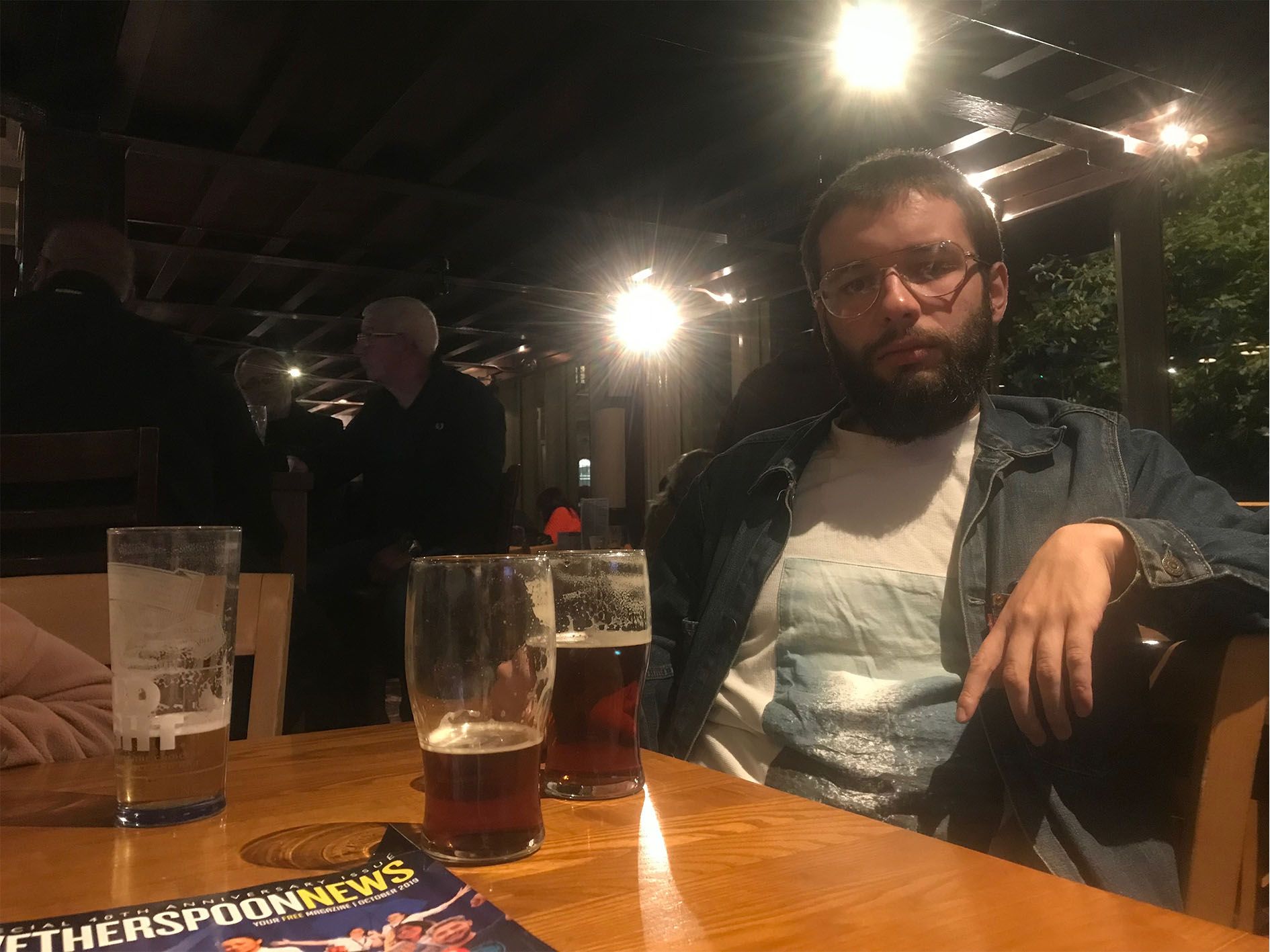 Image may contain: Wood, Bar Counter, Pub, Beer Glass, Glass, Drink, Beer, Alcohol, Beverage, Human, Person