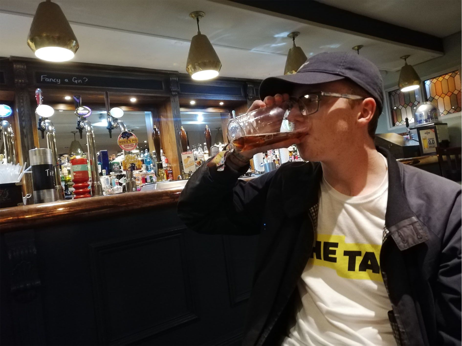 Image may contain: Worker, Clothing, Apparel, Alcohol, Beverage, Drink, Accessories, Sunglasses, Accessory, Bar Counter, Pub, Person, Human