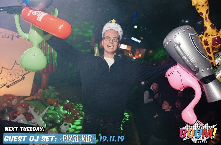 Image may contain: Clothing, Apparel, Lighting, Guitar, Musical Instrument, Leisure Activities, Female, Party, Night Club, Night Life, Smile, Face, Club, Ball, Balloon, Human, Person