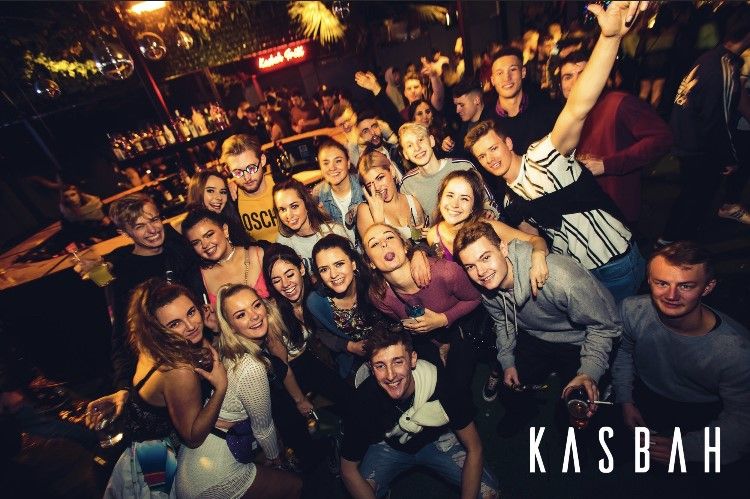 Image may contain: Crowd, Audience, Smile, Clothing, Apparel, Night Club, Face, Club, Human, Person, Night Life, Party