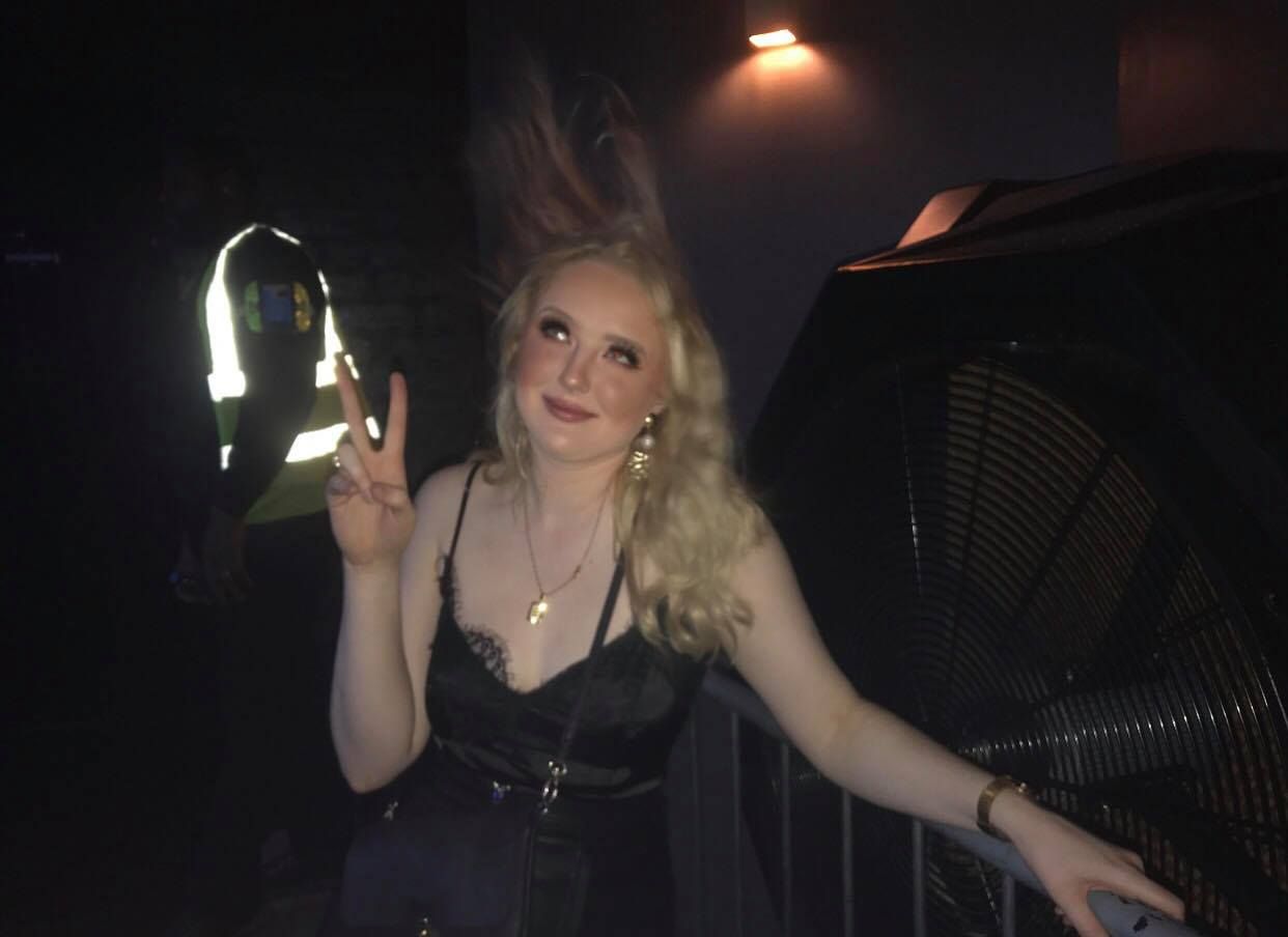 Image may contain: Evening Dress, Robe, Gown, Fashion, Finger, Clothing, Apparel, Night Life, Person, Human