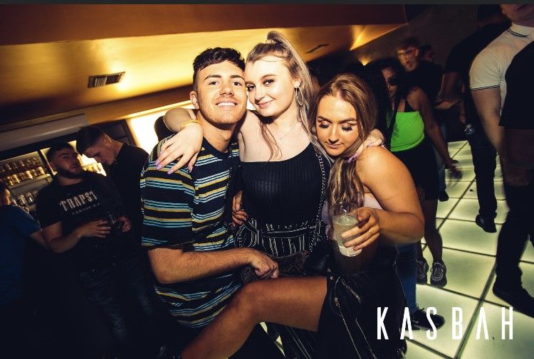 Image may contain: Night Life, Dress, Female, Face, Night Club, Apparel, Shoe, Footwear, Clothing, Club, Party, Person, Human