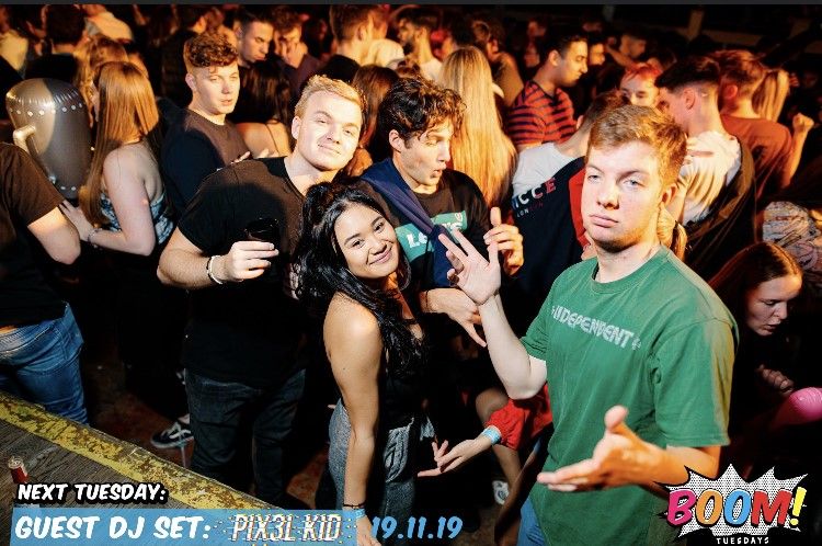 Image may contain: People, Night Club, Club, Face, Indoors, Interior Design, Night Life, Apparel, Helmet, Clothing, Party, Crowd, Audience, Human, Person