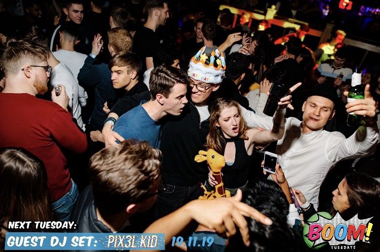 Image may contain: People, Night Club, Night Life, Club, Audience, Crowd, Party, Human, Person