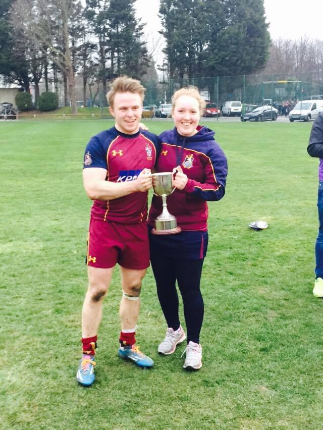 Champion: Katie Lightowler (right) proudly holds the Varsity trophy