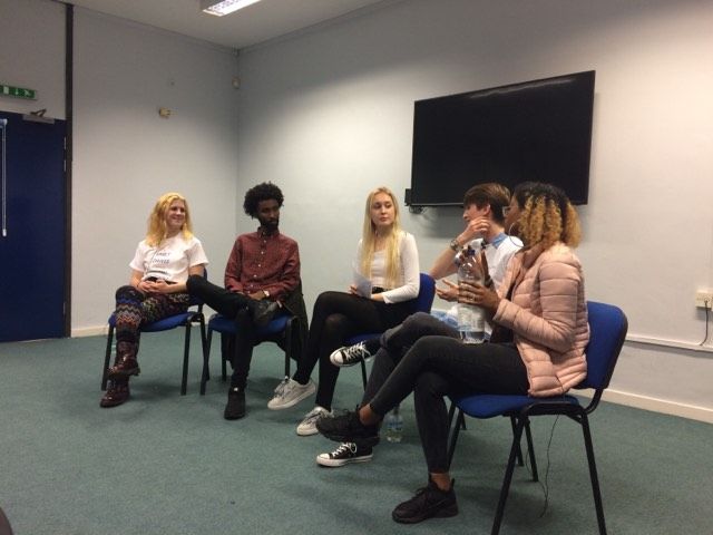 Image may contain: Furniture, Couch, Television, TV, Screen, Monitor, Electronics, Woman, Girl, Female, Blonde, Sitting, Person, People, Human