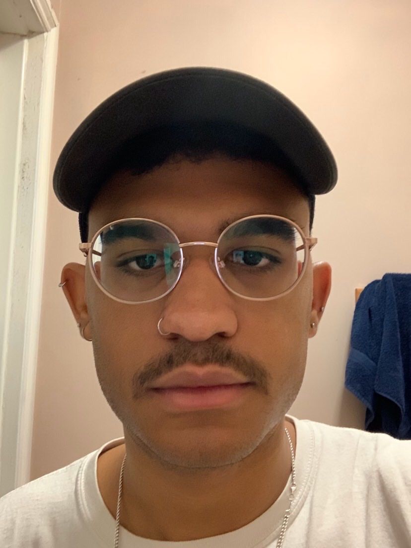 Image may contain: Portrait, Photo, Photography, Mustache, Hat, Apparel, Clothing, Face, Human, Person, Accessory, Accessories, Glasses