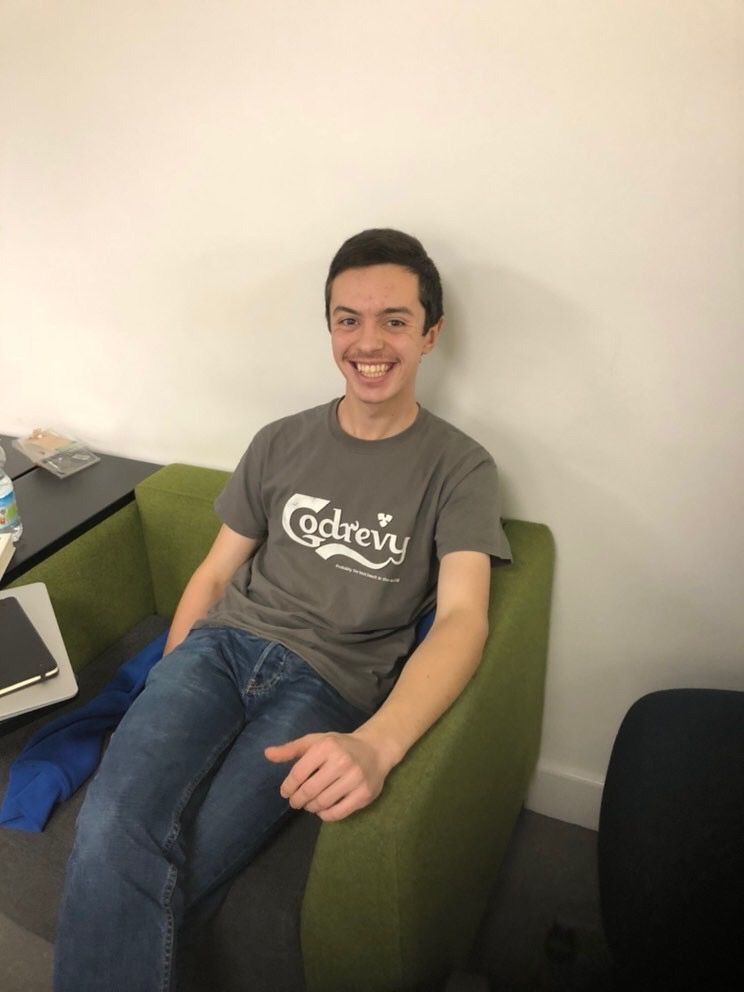 Image may contain: Sitting, People, LCD Screen, Screen, Display, Monitor, Laptop, Face, Pc, Computer, Electronics, Denim, Jeans, Couch, Chair, Apparel, Clothing, Pants, Furniture, Human, Person