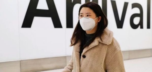 Image may contain: Skin, Overcoat, Text, Sweater, Coat, Human, Person, Face, Clothing, Apparel