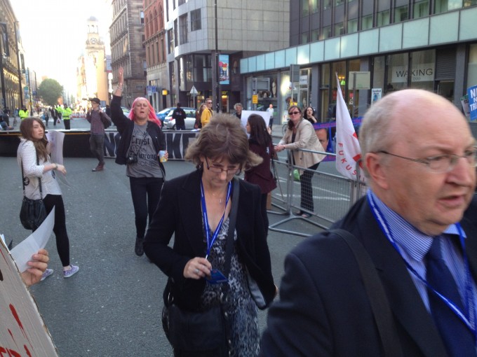Two tories getting a lashing from the lass behind