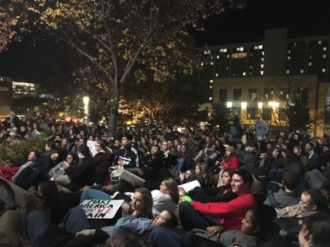the crowd sitting in silence