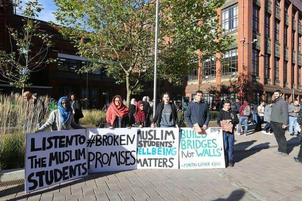 Image may contain: Potted Plant, Plant, Parade, Crowd, Human, Person, People