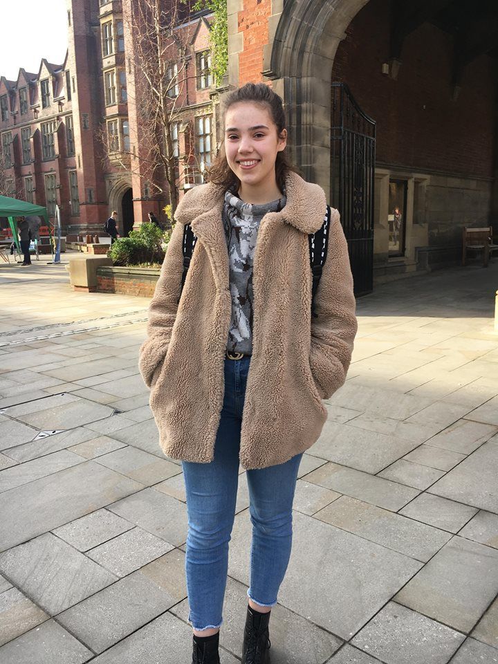 Image may contain: Overcoat, Coat, Sweater, Clothing, Cardigan, Person, People, Human