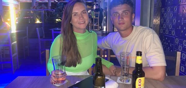 Image may contain: Bar Counter, Glass, Pub, Beer Bottle, Bottle, Alcohol, Beer, Beverage, Drink, Person, Human