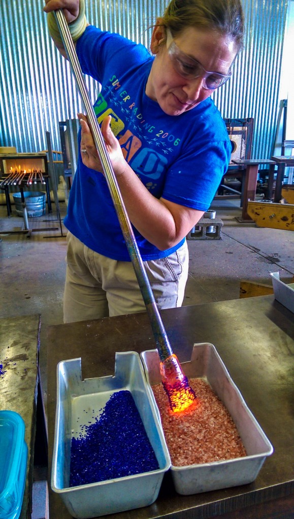Abby adds color to a pumpkin base.