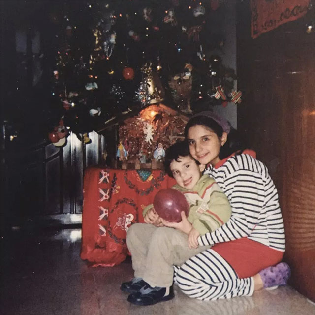Mario and I hug in front of our Christmas tree at home in 2008