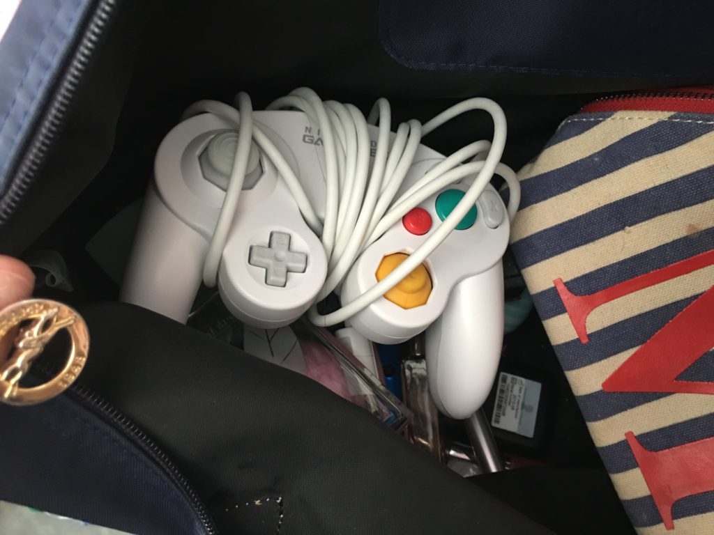 Casual Gamecube controller chilling in my purse because you never know when you need to play some Super Smash Brothers Melee